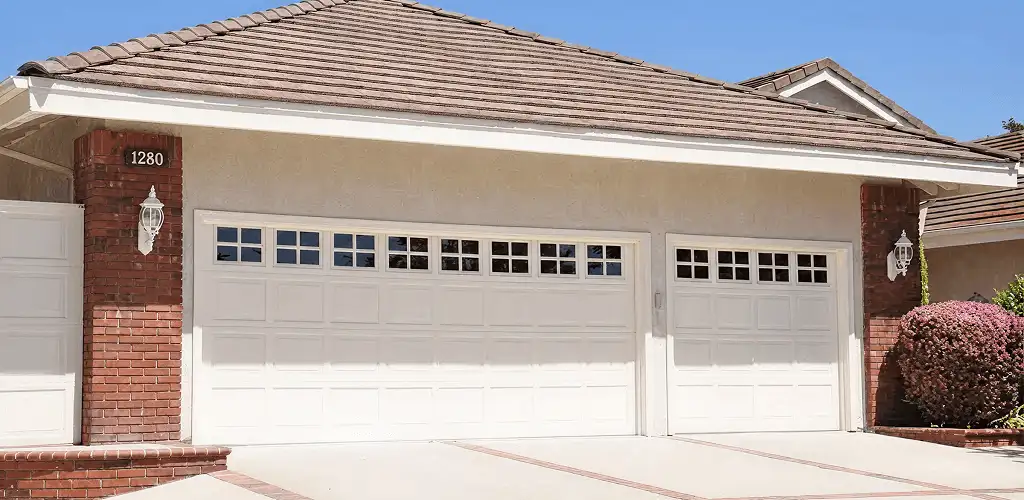 Residential garage door repair service for a double garage door in Chicago, IL