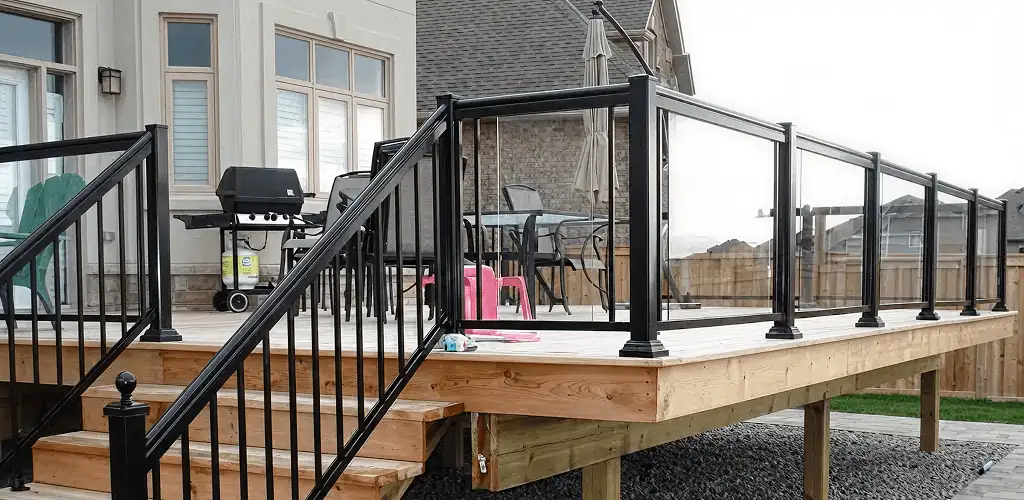 Handrail installation on a deck staircase for safety and code compliance in Chicago, IL